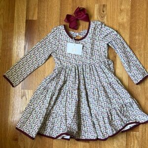 Brand New Girls Long sleeve dress and matching bow.